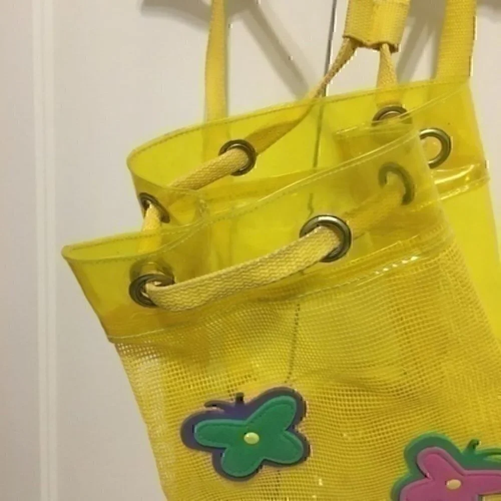 Girl’s yellow beach bag